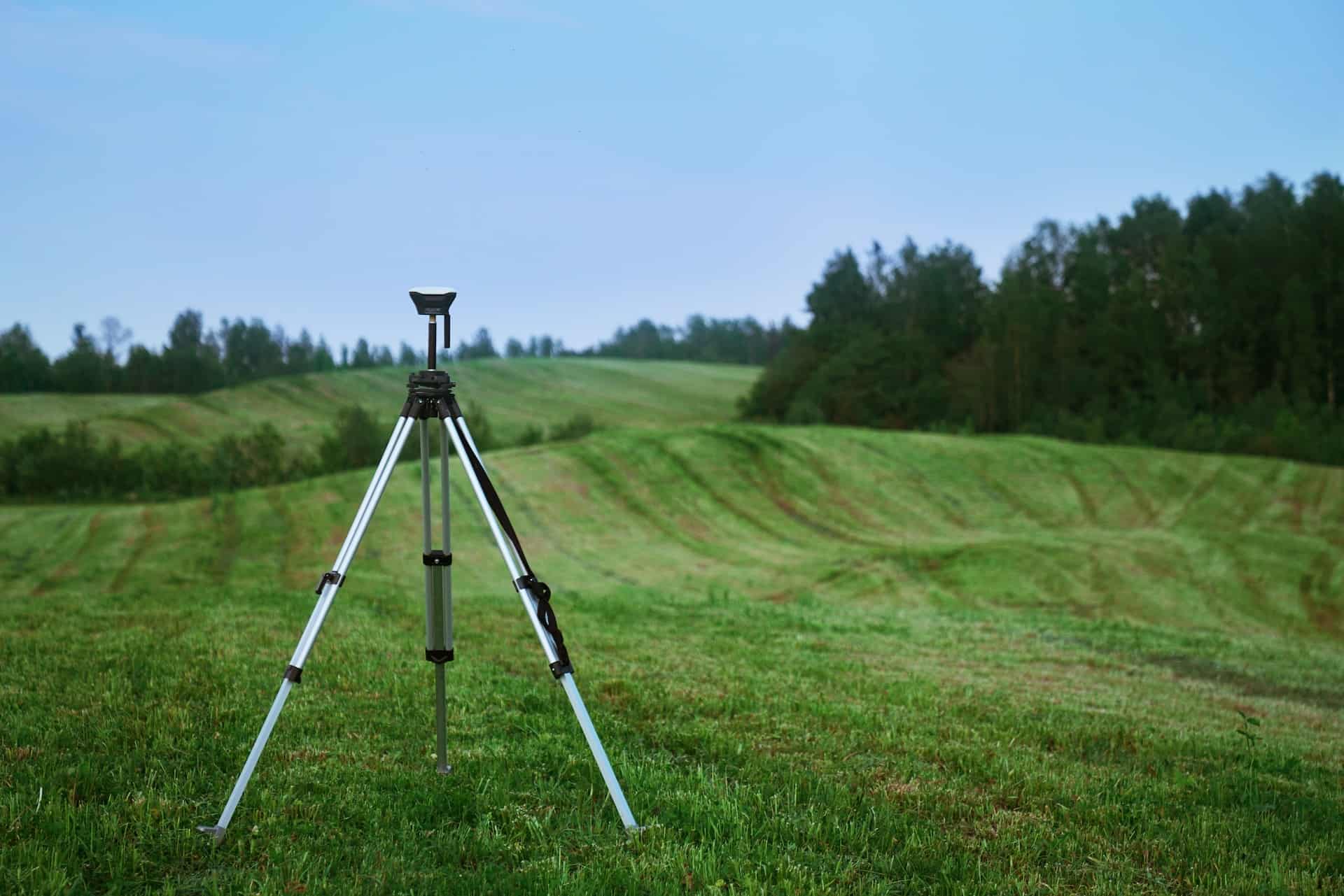 a land survey tripod on a field