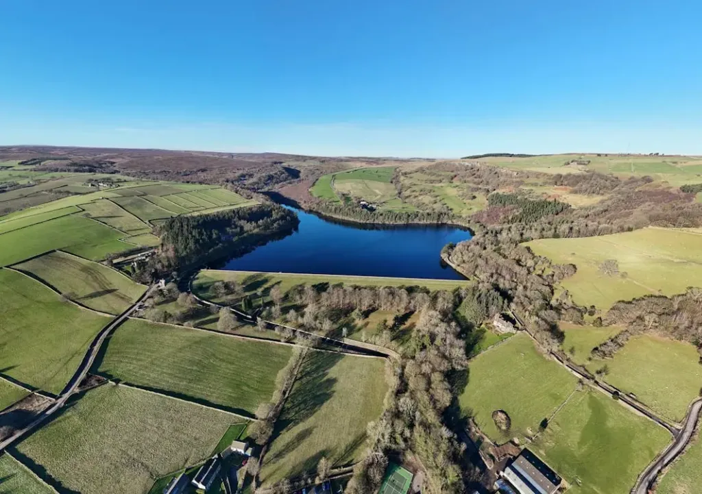 reservoir and green fields