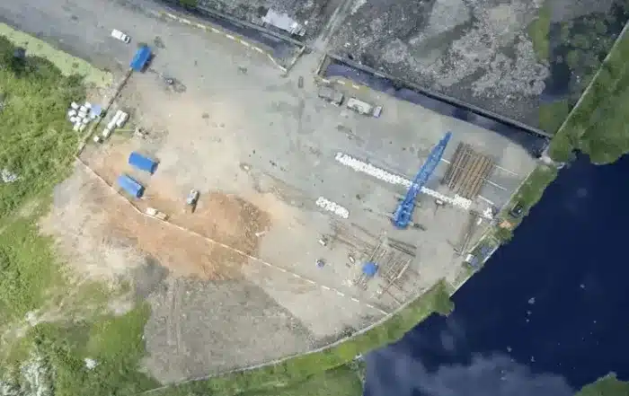 aerial drone view of commercial land surveyor conducting boundary survey in Oklahoma City