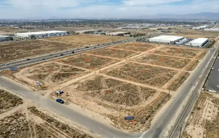 Aerial drone view of commercial land parcels in Bakersfield California with survey markers